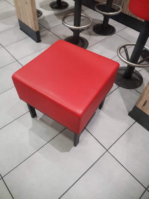 The re-upholstery of a restaurant stool