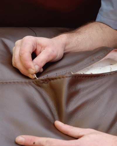 Re-stitching of a leather seat cushion