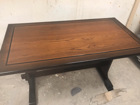 Picture of the wooden table after being fully restored